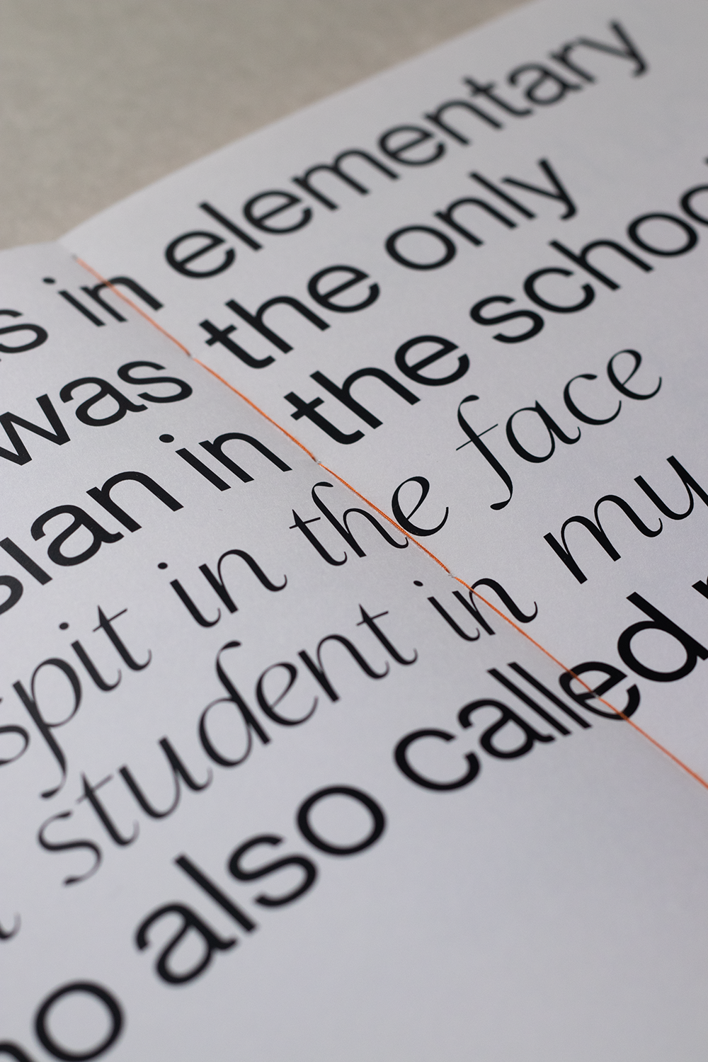 Close-up picture of a quote, showing orange thread from the binding.